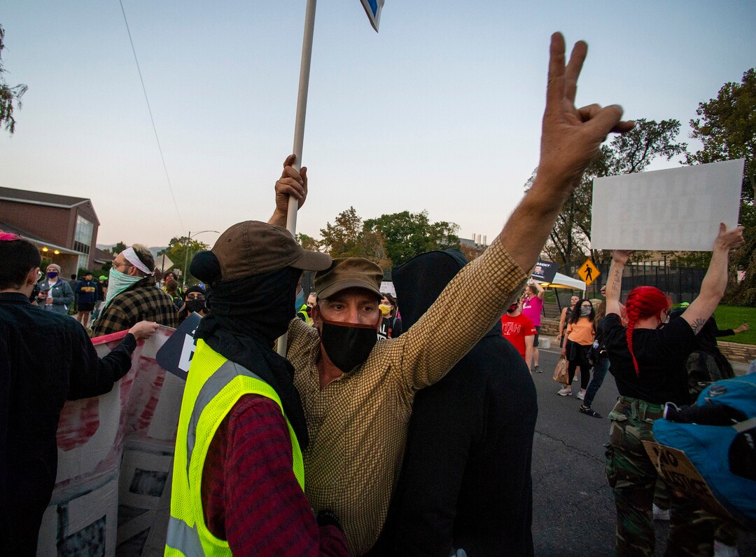 (Rick Egan  |  The Salt Lake Tribune)   A man tries to agitate protesters during a march near the University of Utah where Mike Pence is debating Kamala Harris on Wednesday, Oct. 7, 2020.