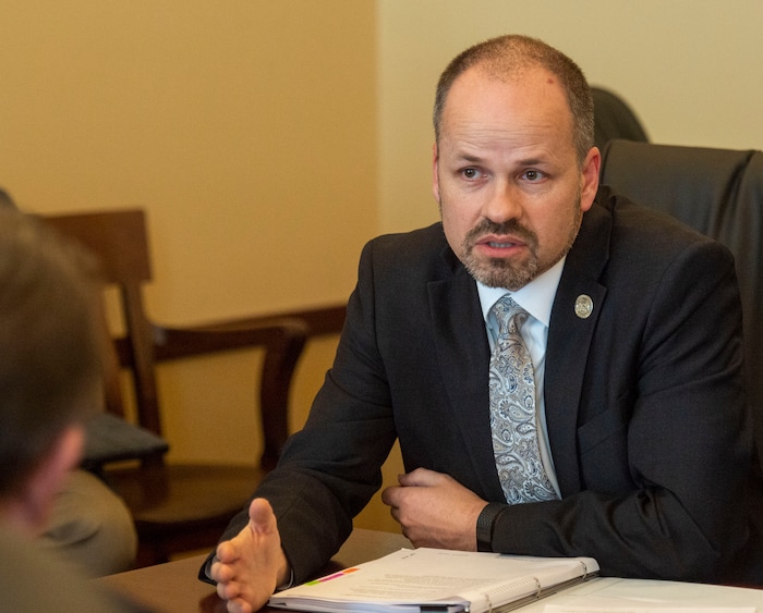 (Rick Egan  |  The Salt Lake Tribune)   Rep. Timothy Hawks meets with members of the senate about the alcohol bill, Thursday, March 14, 2019. 

