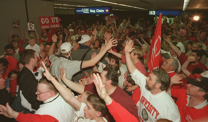 (Trent Nelson  |  Tribune file photo)  Utah fans cheer on members of the basketball team as they arrive at the Salt Lake Airport after defeating Arizona in 1998. The Utes  advanced to the Final Four, where they beat North Carolina, only to lose to Kentucky in the championship game in San Antonio, Texas.