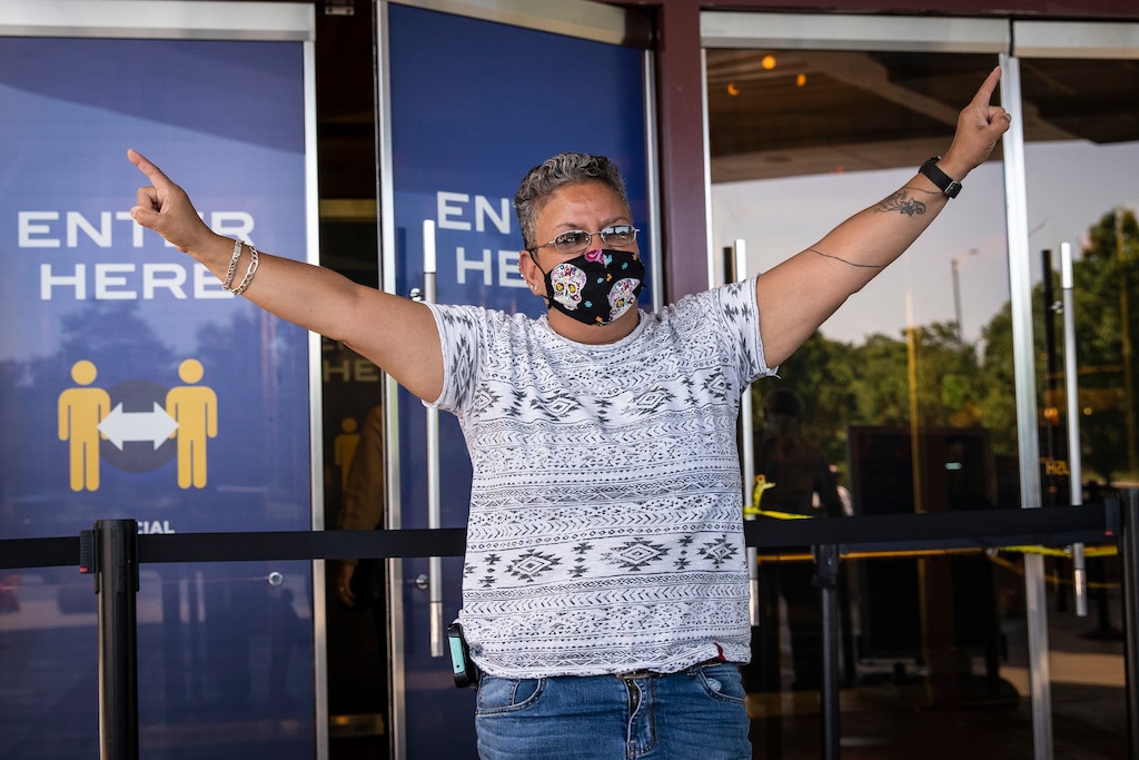A Mount Prospect woman who identified herself as "Sunshine" celebrates as she enters Rivers Casino in Des Plaines on the first day of reopening following an unprecedented three-month shutdown due to the coronavirus pandemic, Wednesday, July 1, 2020. | (Ashlee Rezin Garcia/Chicago Sun-Times via AP)