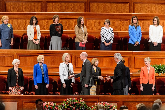 (Trent Nelson | The Salt Lake Tribune)  LDS leaders Henry B. Eyring and Dieter F. Uchtdorf shake hands with leaders at the General Women's Session of the 187th Semiannual General Conference of the The Church of Jesus Christ of Latter-day Saints, in Salt Lake City, Saturday September 23, 2017.