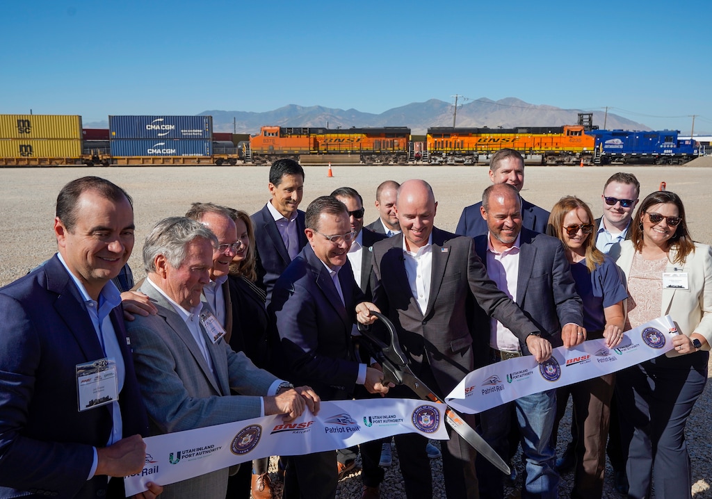 (Chris Samuels | The Salt Lake Tribune) Officials and guests cut a ribbon during the opening of a BNSF intermodal facility in Salt Lake City, Thursday, July 31, 2025.
