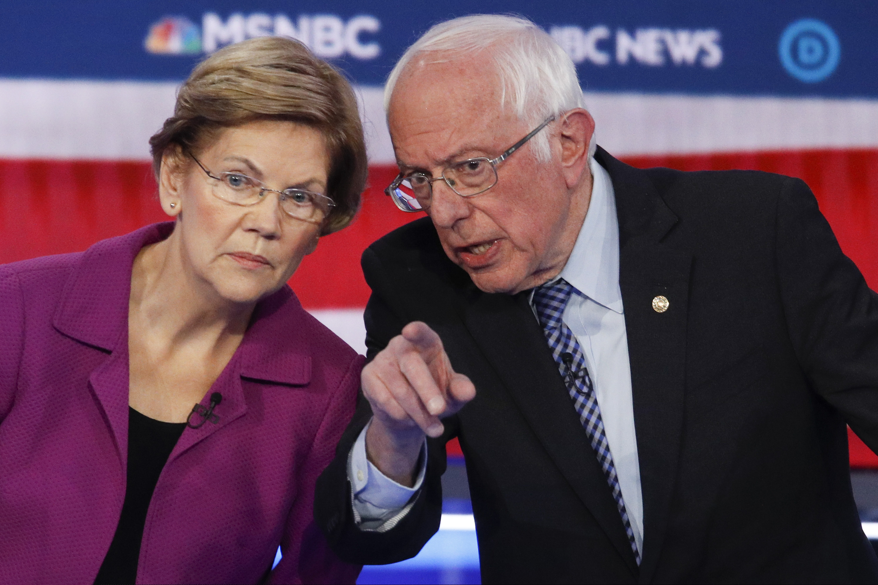 (John Locher | AP) Democratic presidential candidates, Sen. Elizabeth Warren, D-Mass., left, and Sen. Bernie Sanders, I-Vt., talk during a Democratic presidential primary debate Wednesday, Feb. 19, 2020, in Las Vegas, hosted by NBC News and MSNBC.