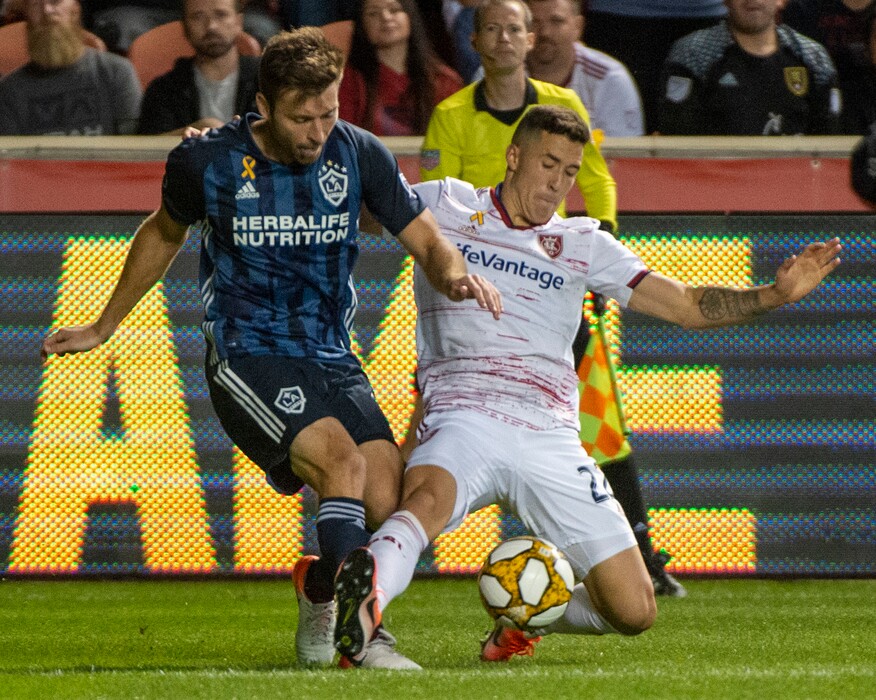 (Rick Egan  |  The Salt Lake Tribune)      Los Angeles Galaxy defender Dave Romney (4) collides with Real Salt Lake defender Aaron Herrera (22), in MLS soccer action between Real Salt Lake and Los Angeles Galaxy at Rio Tinto Stadium, Wednesday, Sept. 25, 2019.