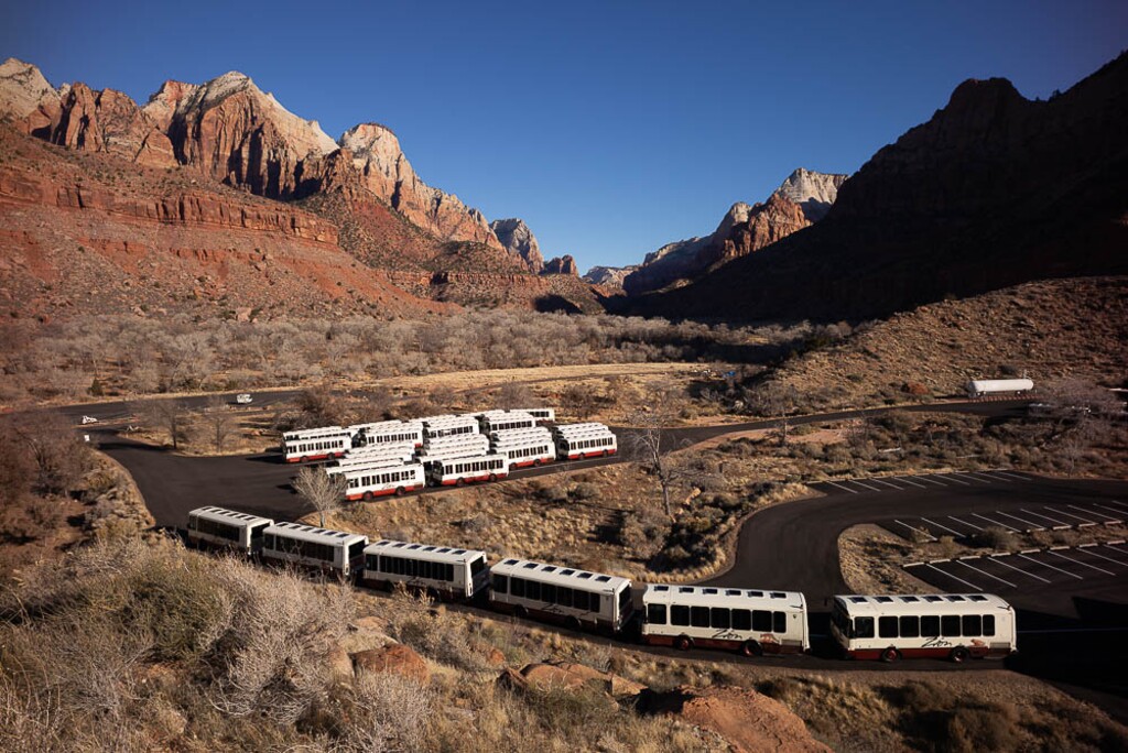 (Trent Nelson | Tribune file)  
The shuttle buses at Zion National Park sit idle in a lot during 2019 government shutdown. The buses have now been sidelined by the coronavirus.