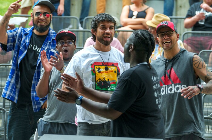 (Leah Hogsten | The Salt Lake Tribune) Ogden Juneteeth celebrants react to rapper Dennis James the Butcher at the Utah Juneteenth Celebration at the Ogden City Amphitheater, Saturday, June 18, 2022. 