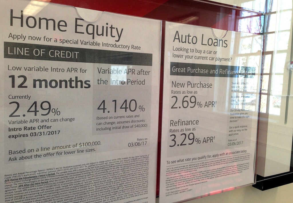 (AP Photo/Elise Amendola, File) In this March 6, 2017, file photo, home equity and auto loan rates are displayed at a bank in North Andover, Mass. On Monday, Jan. 8, 2018, the Federal Reserve releases its November report on consumer borrowing.