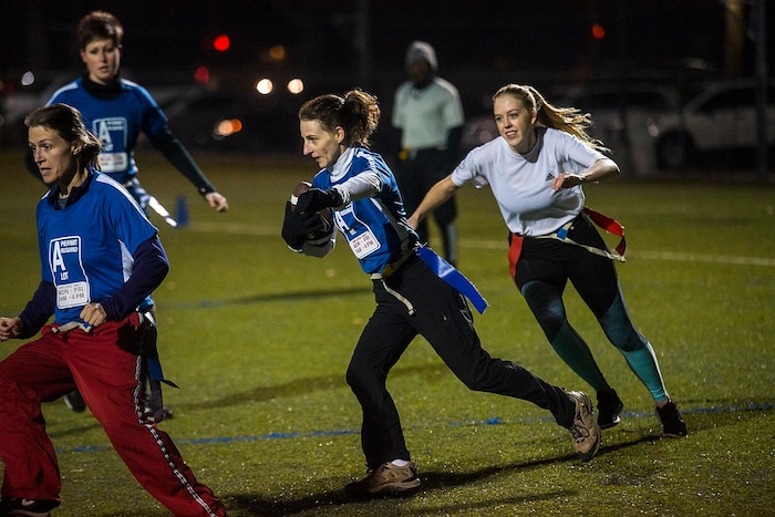 (Chris Detrick | The Salt Lake Tribune) Team A Lot's Leslie Hadfield runs the ball during the flag football team game against Sim Team at North University Fields in Provo Thursday, November 30, 2017.