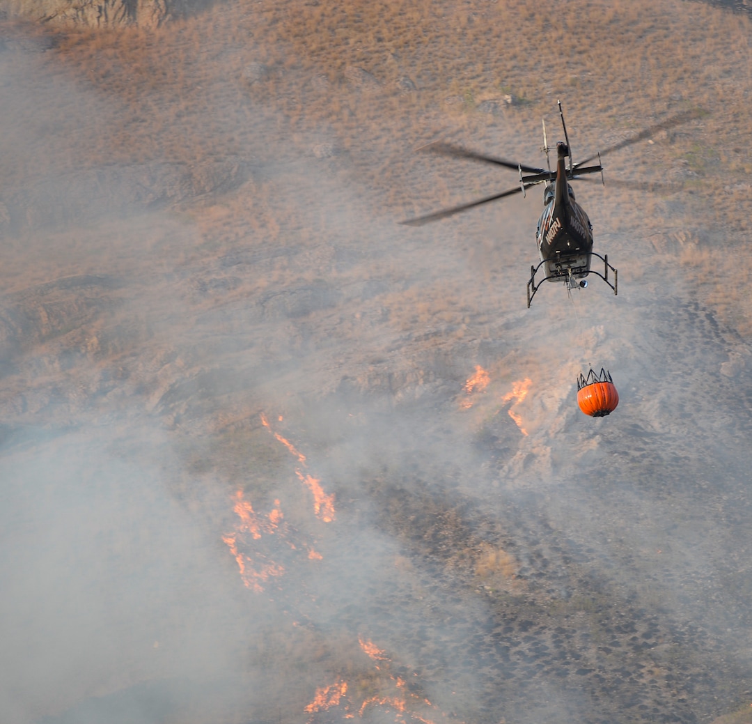 (Francisco Kjolseth  |  The Salt Lake Tribune)  Crews battle a grass fire in Tooele county being dubbed the Green Ravine fire as it burns on Tuesday, Sept. 3, 2019.