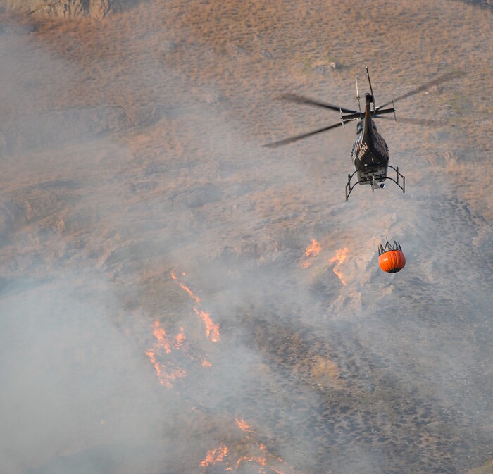 (Francisco Kjolseth  |  The Salt Lake Tribune)  Crews battle a grass fire in Tooele county being dubbed the Green Ravine fire as it burns on Tuesday, Sept. 3, 2019.