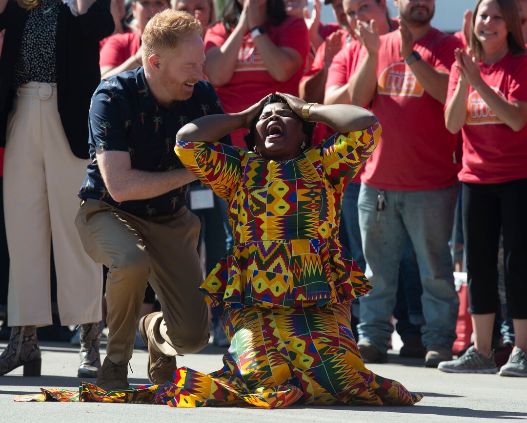 (Rick Egan  |  The Salt Lake Tribune)        Jesse Tyler Ferguson assists Anifah Barobi as she reacts to first seeing her new home, during an episode of the TV show "Extreme Makeover: Home Edition" in Ogden, Thursday, Aug. 15, 2019.