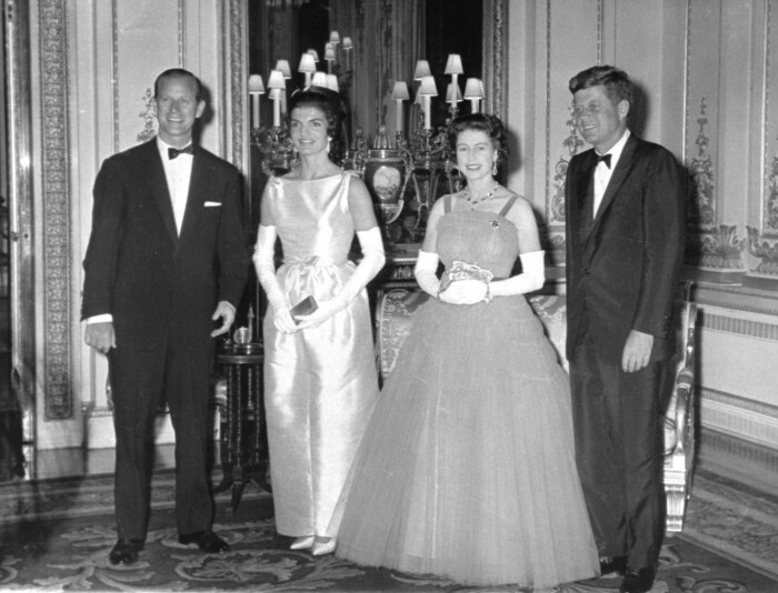 FILE - In this June 5, 1961 file photo, Queen Elizabeth II poses with U.S. President John F. Kennedy, before a state dinner at Buckingham Palace. At left is the Duke of Edinburgh and Kennedy's wife, Jackie, is at second left. Monday, May 29, 2017 marks the 100-year anniversary of John F. Kennedy's birth. (AP Photo/Pool)