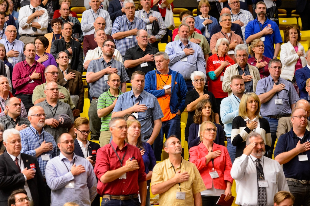 (Trent Nelson | Tribune file photo) Delegates stand with hands over hearts during the national anthem at the Utah Republican Party's 2019 Organizing Convention at Utah Valley University in Orem. Five candidates filed to be the new chair of the GOP by Thursday's deadline, with the winner to be elected at the May 1 state party convention.
