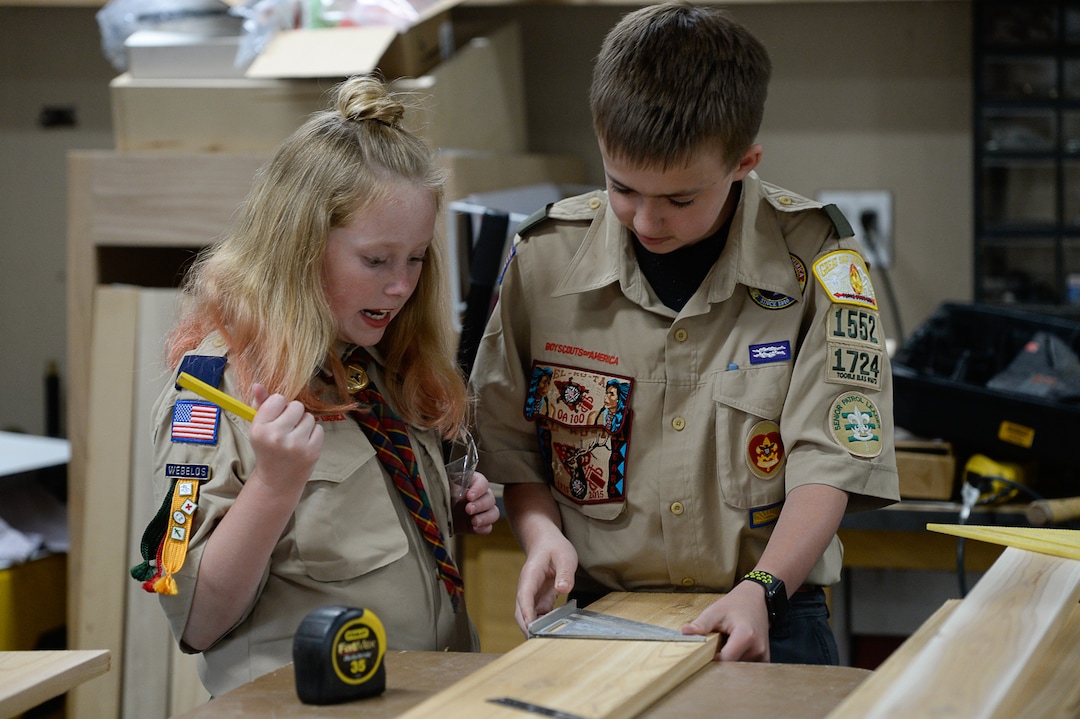 (Francisco Kjolseth  |  The Salt Lake Tribune)  Miriam Cook, 11, helps her brother Kolbie, 12, with his Eagle Scout project as they assemble bird houses in the family garage in Tooele on Monday, May 14, 2018. Miriam, who is one of the early adopters into the Cub Scouts, has always been interested in the things her brother did in Scouting. Her goal is to earn her Arrow of Light, the bridge between Cub Scouts and Boy Scouts (which will change its name to Scouts BSA next February).