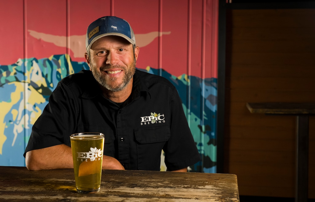 (Bethany Baker  |  The Salt Lake Tribune) Manager Ryan Kluh sits at a table on the new patio at Epic Brewing In Salt Lake City on Friday, May 22, 2026. 