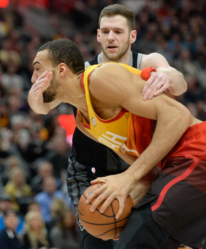 (Francisco Kjolseth  |  The Salt Lake Tribune)  Utah Jazz center Rudy Gobert (27) gets an arm full from Detroit Pistons forward Jon Leuer (30) in the first half of their NBA game at Vivint Smart Home Arena Monday, Jan. 14, 2019, in Salt Lake City.