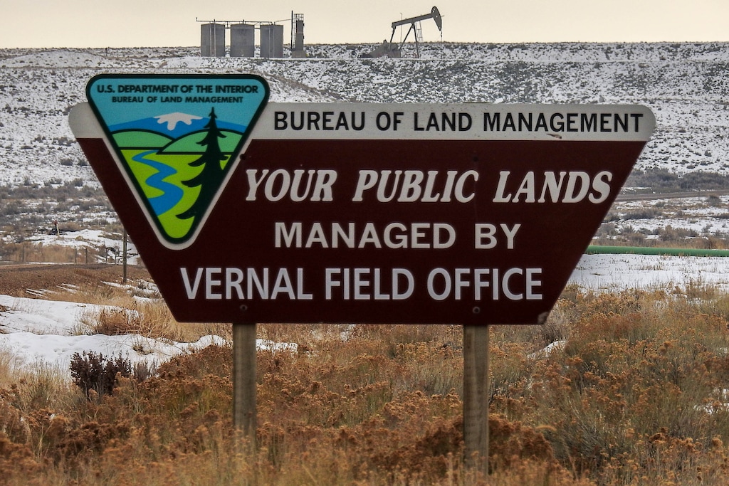 Trent Nelson  |  The Salt Lake TribuneA BLM sign competes with oil wells for attention along the Nine Mile Canyon National Backcountry Byway in Duchesne County, Tuesday January 19, 2016.