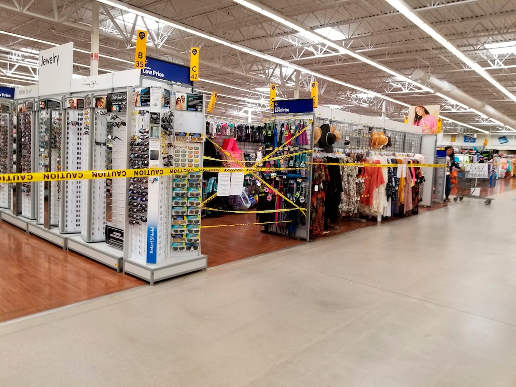 (Patrick Sandoval via AP) Yellow caution tape surrounds sections of merchandise at the Walmart in Gallup, N.M., on Friday, May 1, 2020, to advise shoppers that non-essential items aren't available for purchase.