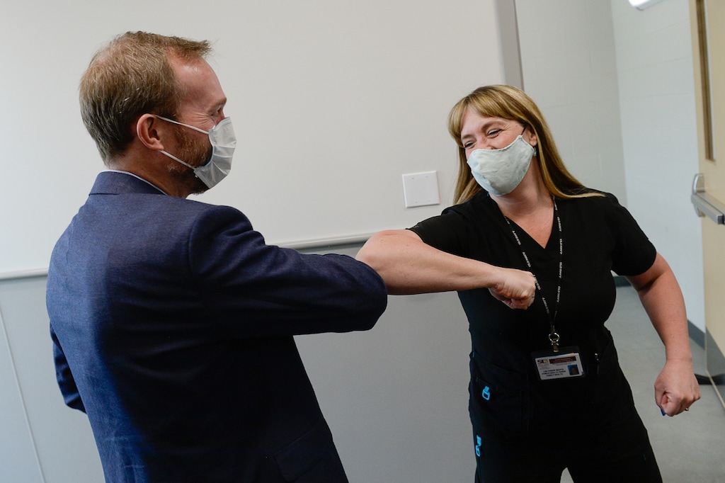 (Francisco Kjolseth  |  Tribune file photo) Congressman Ben McAdams, D-Utah, greets public health nurse Lee Cherie Booth at the Salt Lake County Public Health Center on Tuesday, April 28, 2020, where he thanked employees who are producing vital data about the source of the county's COVID-19 infections and how it may have spread among county residents.
