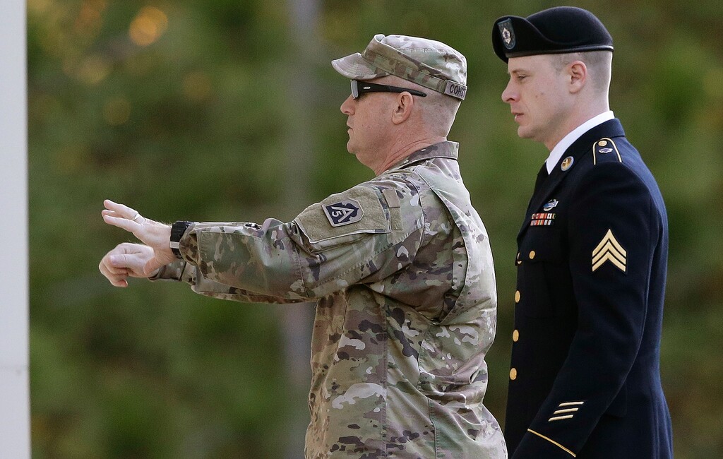 Army Sgt. Bowe Bergdahl, right, arrives at the Fort Bragg courtroom facility for a sentencing hearing at Fort Bragg, N.C., Friday, Nov. 3, 2017. Bergdahl, who walked off his base in Afghanistan in 2009 and was held by the Taliban for five years, pleaded guilty to desertion and misbehavior before the enemy. (AP Photo/Gerry Broome)