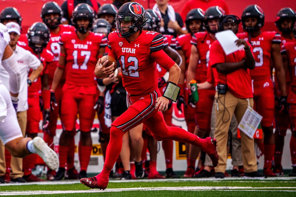 (Trent Nelson  |  The Salt Lake Tribune) Utah Utes quarterback Charlie Brewer (12) runs the ball as the Utah Utes host the Weber State Wildcats in Salt Lake City on Thursday, Sept. 2, 2021.