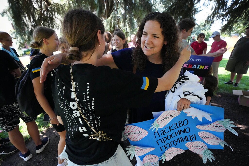 (Francisco Kjolseth  | The Salt Lake Tribune) Megan Wilson greets one of nine Ukrainian folk dancers she will be hosting at her home for the annual World Folkfest in Springville, Sunday, July 28, 2024.