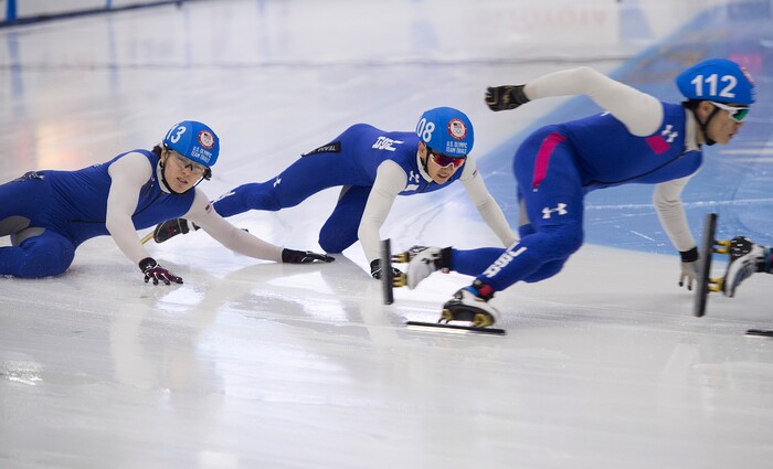 (Scott Sommerdorf   |  The Salt Lake Tribune)   
Gunnar Olson and Brandon Kim fall after bumping during a men's 1000 meter race during day 3 of the U.S. short-track Olympic Team Trials at the Utah Olympic Oval, Sunday, December 17, 2017.  

