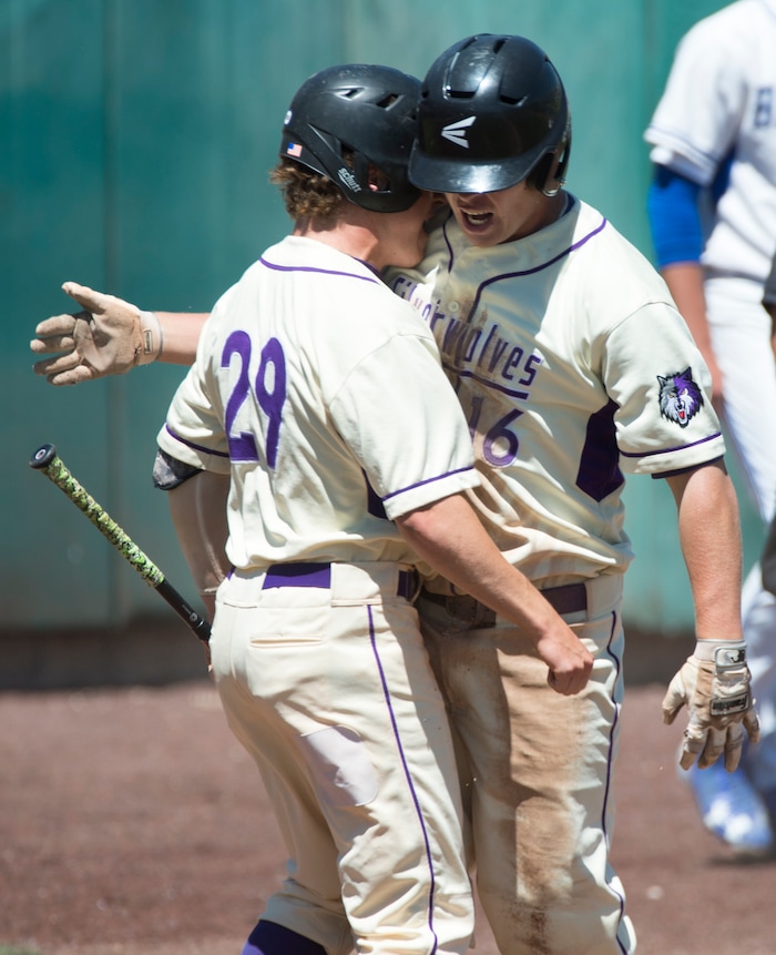  (Rick Egan  |  The Salt Lake Tribune)   Riverton's Gaige Morris celebrates as Nate Hamblin scores a run for the Silverwolves, in 6A state baseball championship action between Riverton and Bingham, at UVU in Orem, Friday, May 25, 2018.