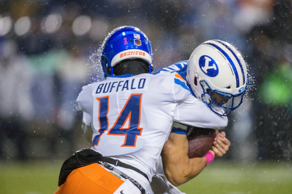 BYU running back Lopini Katoa, right, is tackled by Boise State safety Khafari Buffalo during the first half of an NCAA college football game Saturday, Oct. 19, 2019, in Provo, Utah. (AP Photo/Tyler Tate)