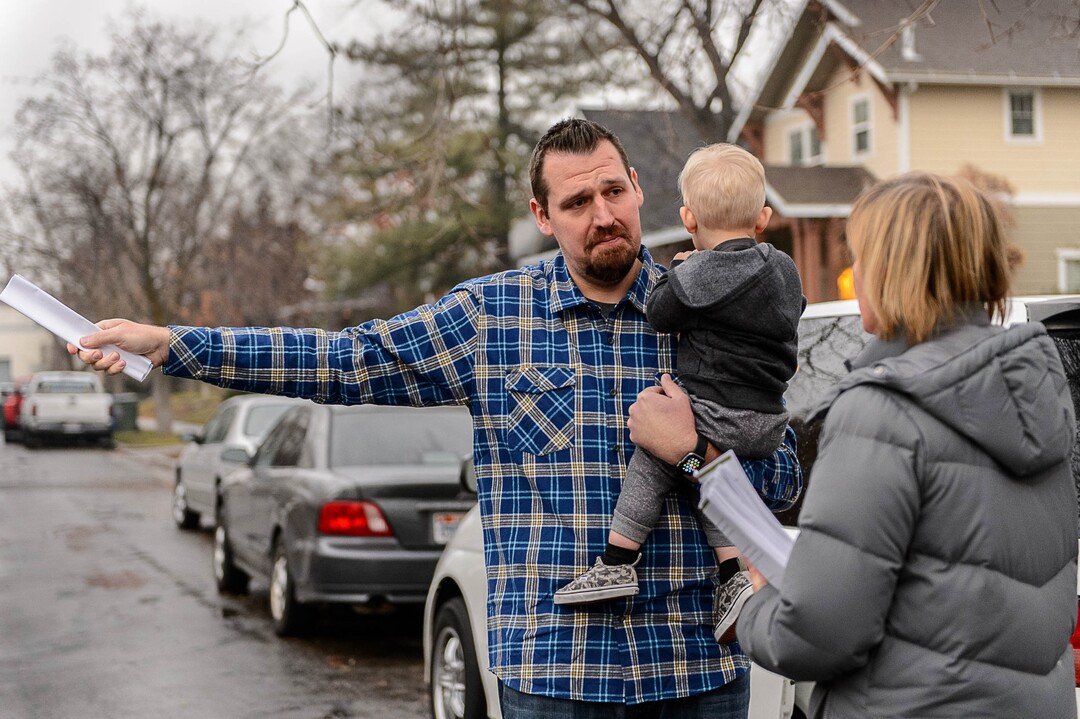 (Trent Nelson  | Tribune file photo)  Salt Lake City resident Chris Sveiven, holding his son Weston, expresses his displeasure over the announced homeless shelter at 653 E. Simpson Avenue to Councilwoman Lisa Adams, Wednesday December 14, 2016. "This is a nightmare," Sveiven said. Adams went door-to-door in the area to hear from and explain to residents what they should expect from the planned homeless shelter at that address. Adams was accompanied by a police officer after receiving threatening emails.