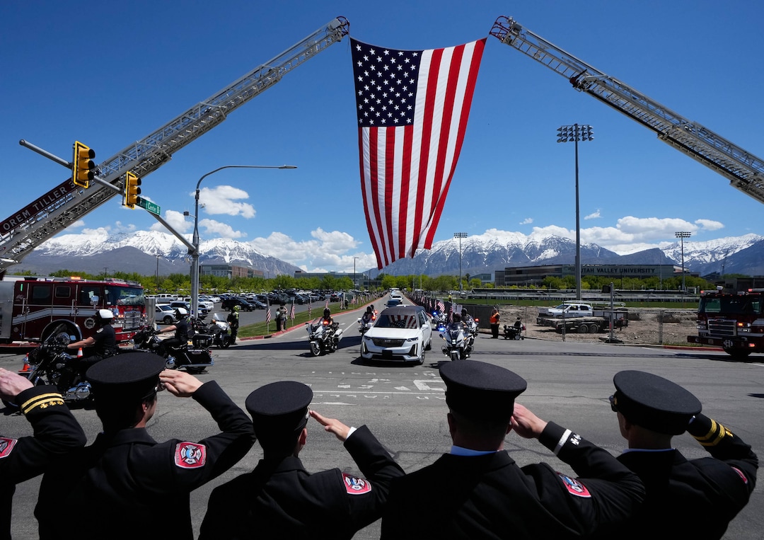 (Francisco Kjolseth  |  The Salt Lake Tribune) Members of the Orem Fire Department salute the hearse containing the body of Santaquin police Sgt. Bill Hooser following ceremonies at the UCCU Center at Utah Valley University in Orem on Monday, May 13, 2024.