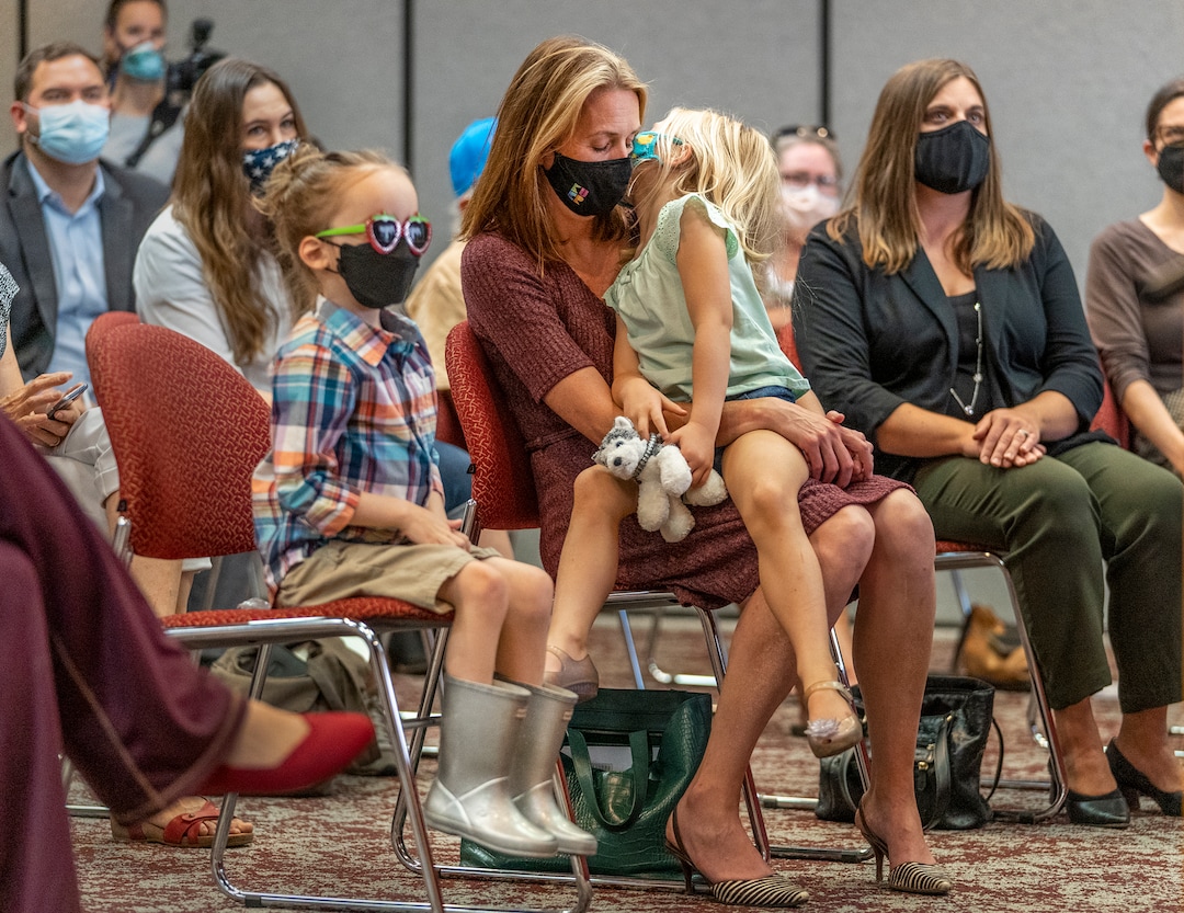 (Leah Hogsten | The Salt Lake Tribune) Rep. Jen Dailey-Provost, D-Salt Lake City, gets a kiss from her daughter Maggie, 4, during Monday's press conference. A group of Utah parents is suing the state for its ban on school districts enacting their own mask mandates which they say leaves their kids unnecessarily unprotected and at-risk from COVID-19 in the classroom, Aug. 23, 2021.