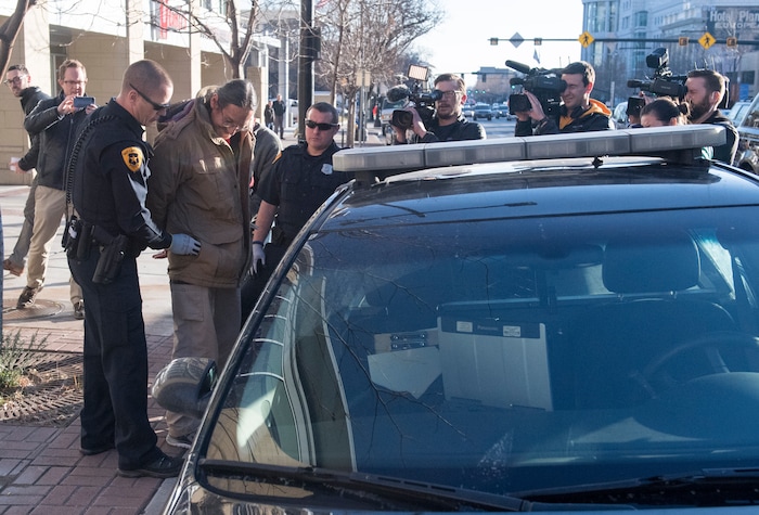 (Rick Egan  |  The Salt Lake Tribune)  Jackie Sanchez is searched by the Salt Lake City Police in front of a half dozen tv cameras as he is arrested by Salt Lake City police, after a media conference in his attorney's office about the abuse of force claim that is being filed against the Salt Lake City Police, after Sanchez was attacked by a police dog on July 28. Wednesday, December 6, 2017.



