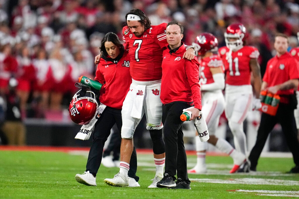(Marcio Jose Sanchez | AP) Utah quarterback Cameron Rising (7) is helped off the field during the second half in the Rose Bowl NCAA college football game against Penn State Monday, Jan. 2, 2023, in Pasadena, Calif.