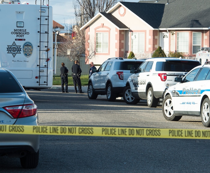 (Rick Egan | The Salt Lake Tribune) Investigators from West Valley and Unified Police investigate an officer involved shooting, leaving the suspect dead, in West Valley City, Sunday, April 8, 2018.