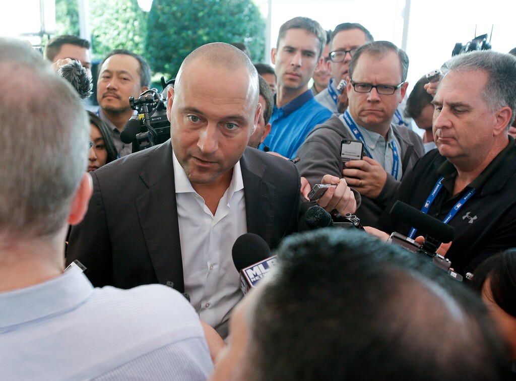 Derek Jeter, chief executive officer and part owner of the Miami Marlins, talks with members of the media at the annual MLB baseball general managers' meetings, Wednesday, Nov. 15, 2017, in Orlando, Fla. (AP Photo/John Raoux)
