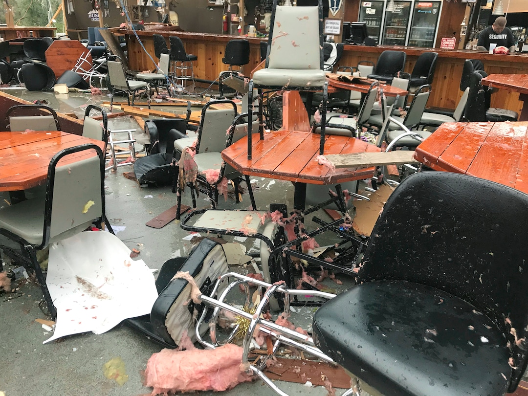 In this Sunday, March 3, 2019 photo, debris litters the Buck Wild Saloon, after it was heavily damaged by a tornado, in Smiths Station, Ala.  (Sara Palczewski/Opelika-Auburn News via AP)