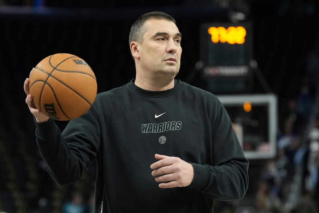 (Darren Yamashita | AP) Golden State Warriors assistant coach Dejan Milojevic passes before an NBA basketball game against the New Orleans Pelicans on March 28, 2023, in San Francisco. Wednesday's game between the Warriors and the Utah Jazz was postponed as the teams mourned his sudden death at age 46.
