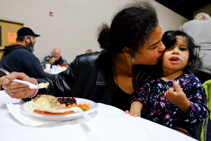 (Francisco Kjolseth | The Salt Lake Tribune) Jennifer Jackson gives her daughter Shylaysha, 2, a kiss as they enjoy a Thanksgiving meal at the Salt Lake City Mission at 1055 North Redwood Road in Salt Lake City, on Thursday, Nov. 28, 2019.