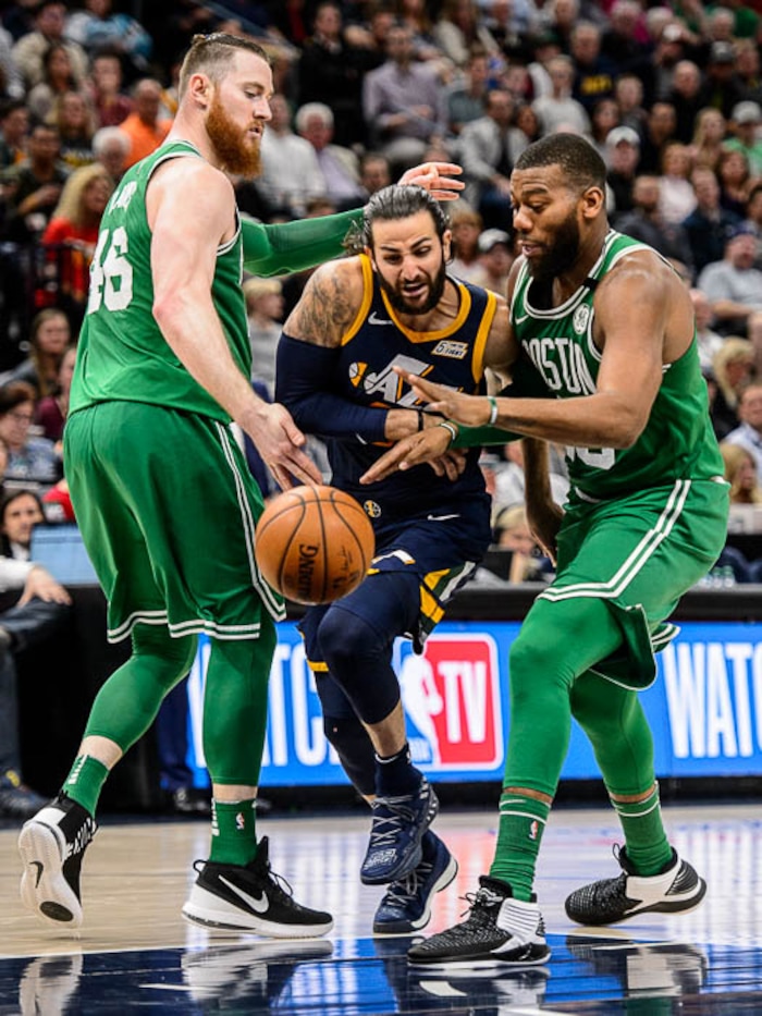 (Trent Nelson | The Salt Lake Tribune)  
Utah Jazz vs. Boston Celtics, NBA basketball in Salt Lake City, Wednesday March 28, 2018. Utah Jazz guard Ricky Rubio (3) goes between Boston Celtics center Aron Baynes (46) and Boston Celtics center Greg Monroe (55).