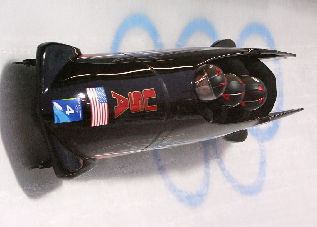USA-2, piloted by Steven Holcomb, makes its first run in Women's Bobsled at the Turin 2006 Winter Olympic Games at Cesana Pariol, Italy, Friday, Feb. 24, 2006.  (AP Photo/Michael Sohn)