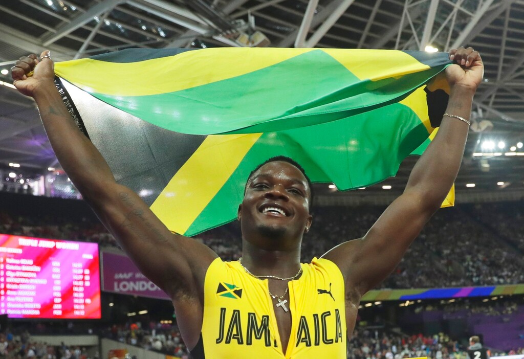 Jamaica's Omar Mcleod celebrates after winning the gold medal in the men's 110-meter hurdles final during the World Athletics Championships in London Monday, Aug. 7, 2017. (AP Photo/Matt Dunham)