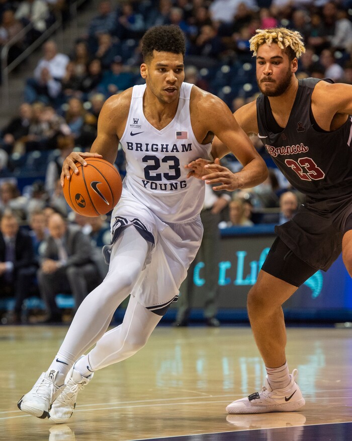 (Rick Egan  |  The Salt Lake Tribune)       Brigham Young Cougars forward Yoeli Childs (23) takes the ball down the middle as, Santa Clara Broncos center Ezekiel Richards (23) defends, in basketball action between Brigham Young Cougars and Santa Clara Broncos at the Marriott Center in Provo, Saturday, Jan. 12, 2019.


