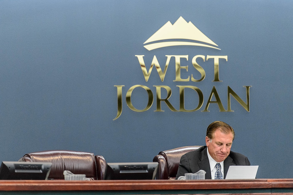 Trent Nelson  |  The Salt Lake Tribune
West Jordan Mayor Kim Rolfe reads a statement regarding Councilman Jeff Haaga's recent citation during a council meeting Aug. 10, 2016. West Jordan's City Council approved a ballot measure Wednesday that will ask voters whether the city should change from its current council-manager makeup, which is no longer supported by state law, to a strong-mayor form with seven councilmembers.