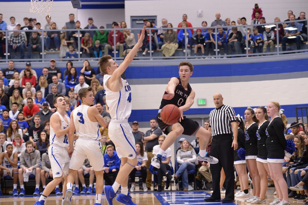 (Leah Hogsten  |  The Salt Lake Tribune)  Lone Peak's Chantry Ross heads out of bounds on a pass under pressure.  Lone Peak High School boys' basketball team defeated Pleasant Grove High School 65-61 during their game Friday, January 26, 2018 in Pleasant Grove. 