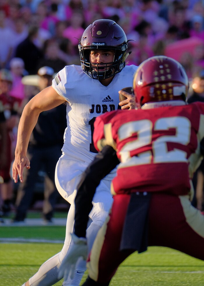 (Leah Hogsten  |  The Salt Lake Tribune) Jordan's  quarterback Crew Wakeley runs for a first down. Jordan High School boys' football team defeated Viewmont High School 28-20 during their class 5A football playoff opener, Friday, October 27, 2017 in Bountiful.