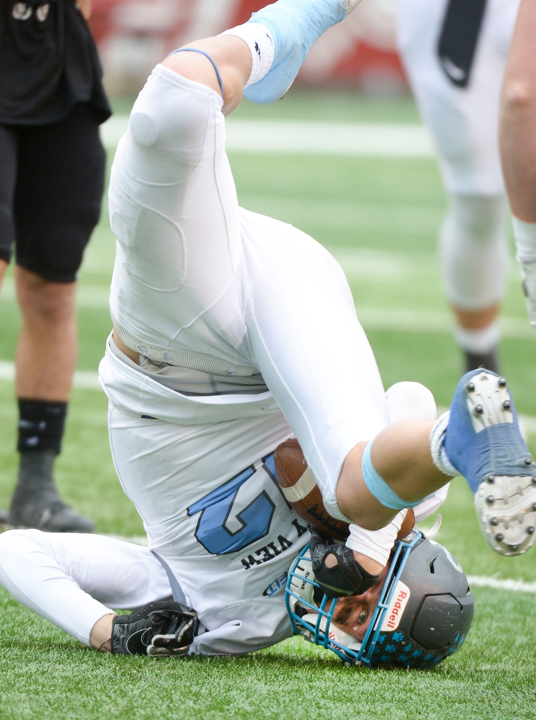 (Leah Hogsten  |  The Salt Lake Tribune)  Sky ViewÕs Mason Falslev goes end over end on a play. Sky View High School defeated Park City 35-0 to win the 4A State Championship football title, Nov. 11, 2019 at Rice-Eccles Stadium.