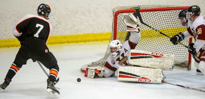 (Steve Griffin  |  The Salt Lake Tribune) After losing his stick Viewmont goalie Keaton Morrison gets as big as he can as Murray's Gage Wood chases the puck during the Division 1 ice hockey state title game at the Salt Lake City Sports Complex in Salt Lake City Tuesday Feb. 20, 2018.