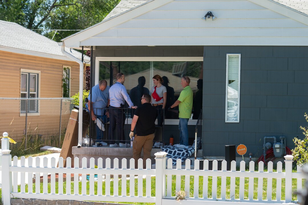 (Rick Egan  |  The Salt Lake Tribune)       Crime scene Investigators gather on the porch of at the Fairpark home on 547 North 1000 West, Friday, June 28, 2019.