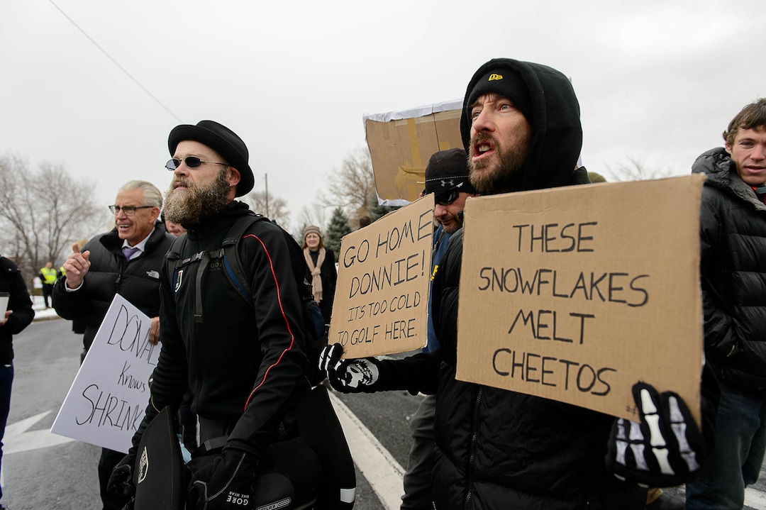 (Trent Nelson | The Salt Lake Tribune)  Protesters from opposite sides yell at each other during a rally against a visit by President Donald Trump, Monday December 4, 2017.